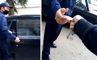 В сети появилось видео как полицейские Уральска забирают удостоверение личности у жителей оцепленного дома