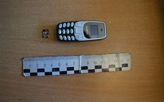Телефон в прямой кишке пытался пронести мужчина в СИЗО Карагандинской области